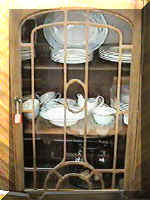 Dishes in China Cabinet Photo