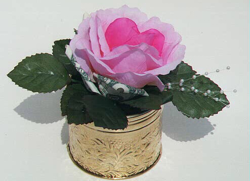 Rose in a brass pot, contains $2