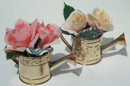 Roses in brass watering cans, each contains $1