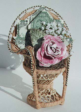 Rose on a fan-back chair, contains $5