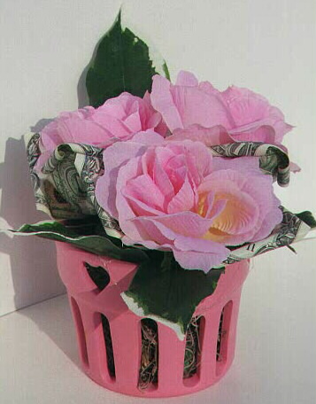 Roses in a ceramic pot, contains $3