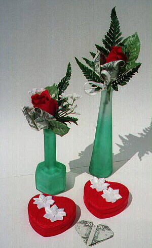 Roses in bud vases and heart-shaped gift boxes (Roses contain $1; boxes-add any amount of cash)