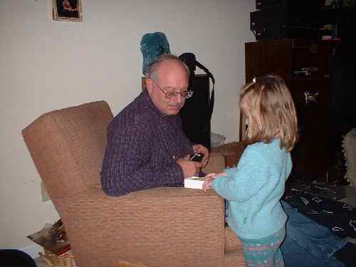 Grandpa talking to Katie about fossils