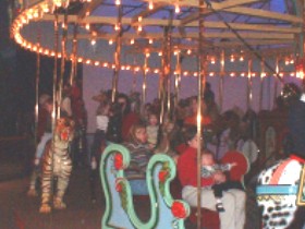 Chaille and Katie on merry go round at Science Museum