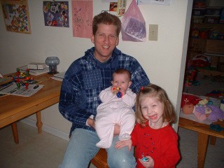 Dad with silly smiling kids