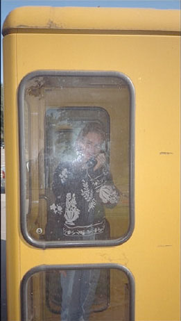 Baj in a phone booth.