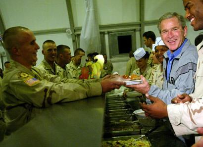 Pres. Bush serving mashed potatoes