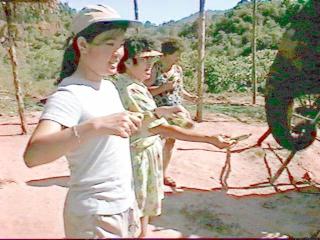 Ting and her mom feeding the elephant