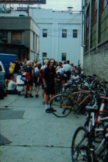 (bikes 10 deep against the warehouse wall)