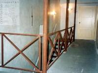 modern hall with rust effect metalwork and patinated walls