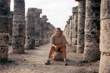 Me, sitting on a rock in the Columns