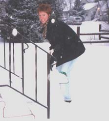 Heather shovels snow