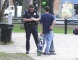 Officer writing out a ticket to a skateboarder.   Click to enlarge.