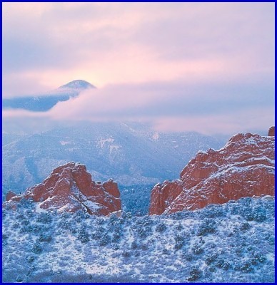 Mantou Mountain {which is in front of and about 4,000 feet lower than Pikes Peak}, is peeking through