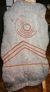 rock carving with sun