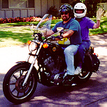 Fat dork and old lady on Sportster