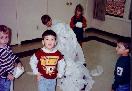 Sam standing in front of Wes (covered in TP)