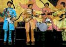 In those LOVELY Sgt. Pepper suits!