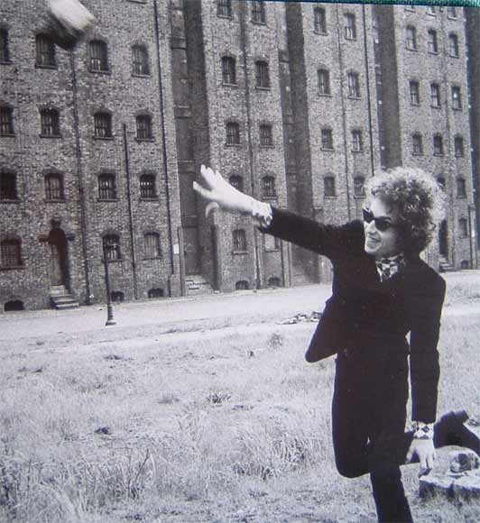 Bob Dylan throwing a brick c.1966