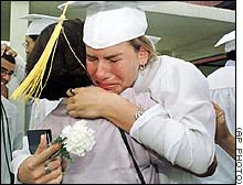 graduate gets hug