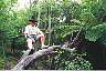 Grant resting on a tree during a hike