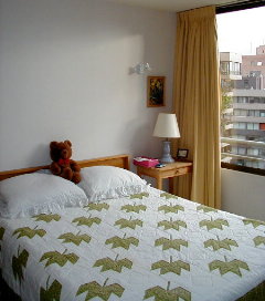 guest room with the maple leaf quilt Margy made