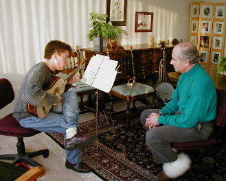 Cristian playing a song on his Baroque guitar