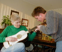 Margy tries to play the Baroque guitar