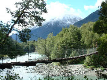 swing bridge and mountain view (18941 bytes)