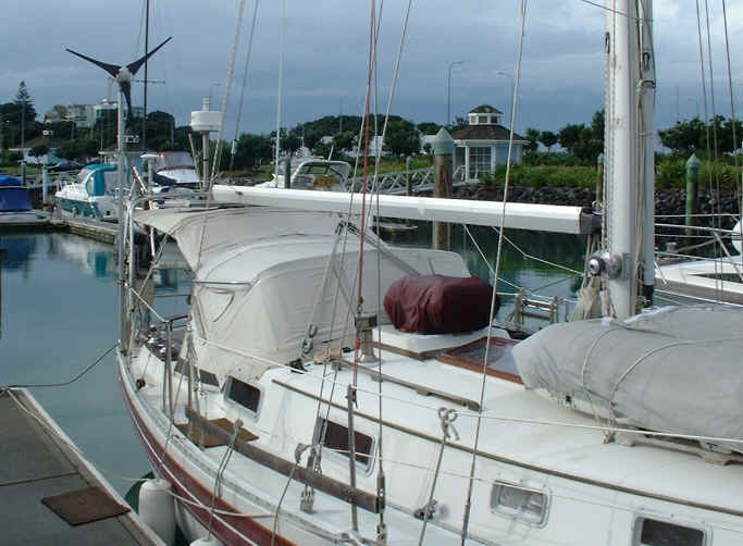 Deck view, dodger and bimini, liferaft and butterfly hatch.