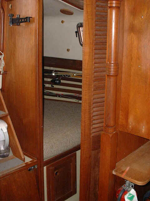 Aft stateroom showing louvered door partially closed.