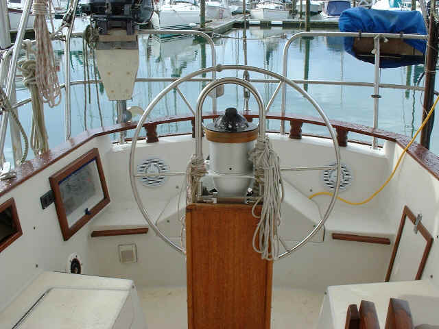 Cockpit; T-shaped, large wheel, pedestal table, cockpit speakers, raised helmsman seat.