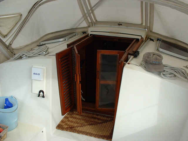 Companionway. Note the double set of doors: screened inners and louvered outers.