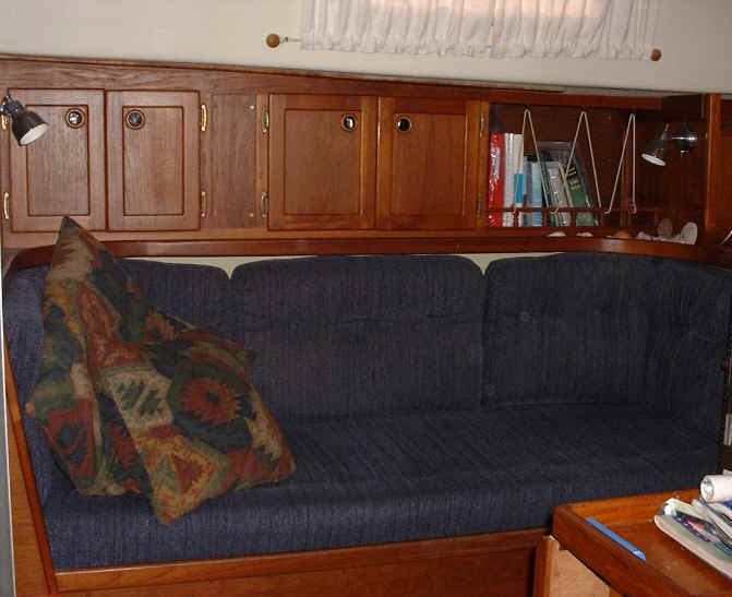 Starboard settee. storage under seats and behing back cushions. 