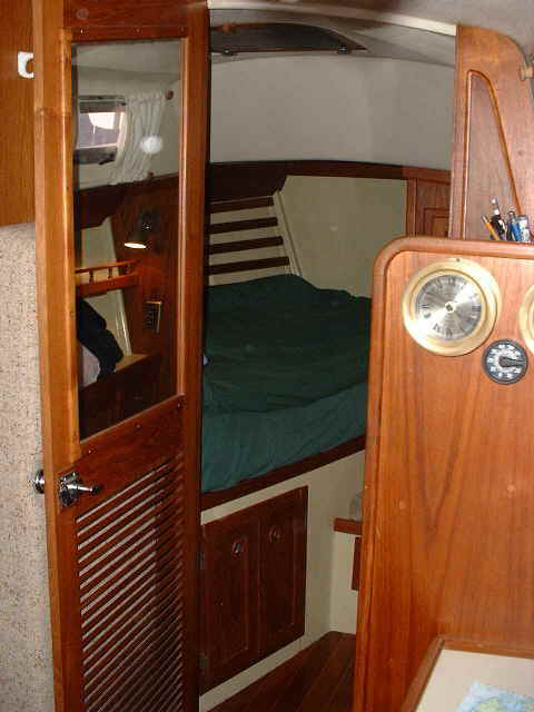 Mirror on stateroom door and louvers for added ventilation.