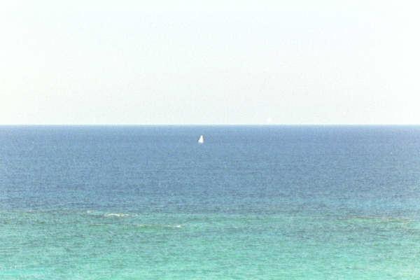 A sailboat alone in the ocean