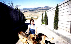 With her german sheppards at the family ranch.