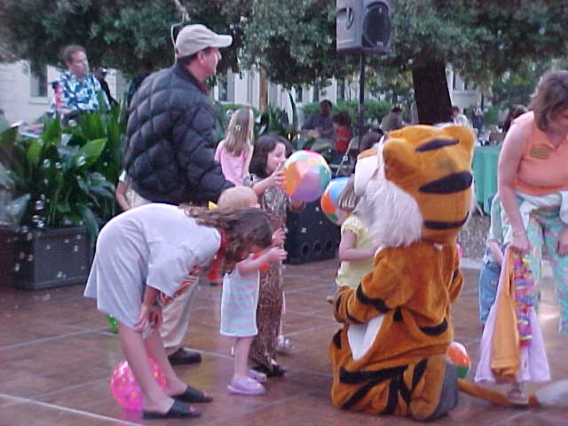 Alumni kids playing with Oxy tiger