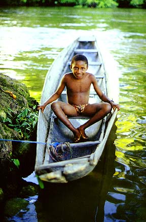 Aucaner boy sitting in a dugout