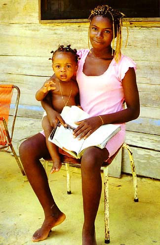 Aucaner girl reading the National Geograhic