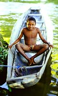 Aucaner boy sitting in a dugout