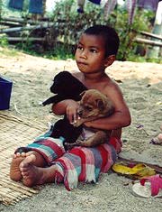 Hilltribe Kid & Puppies