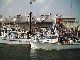 Decorated fishing boat getting blessed