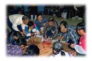 Village Elders Feasting on Raw Caribou and Arctic Char, Cape Dorset, Baffin Island, Northwest Territories