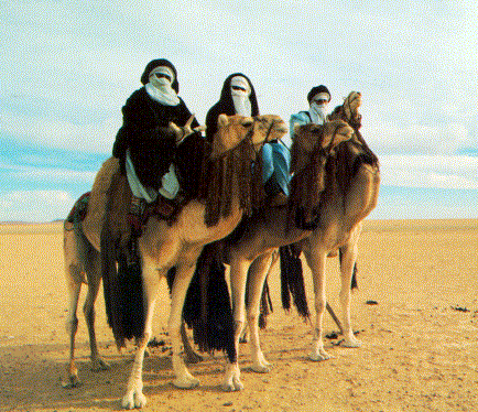  Touareg men use camels to travel across the Sahara=