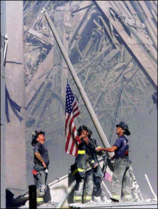 Firefighters raise the U.S.A. flag at the World Trade Center (40k)