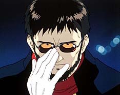 Ikari Gendo is an extremely angular man with jet black hair and square glasses.