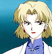 Ritsuko has short blonde hair, black eyebrows and a mole on her left cheek.  She usually wears a lab coat when she works.