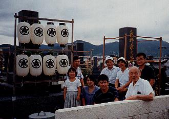 The family gathers around the ohaka