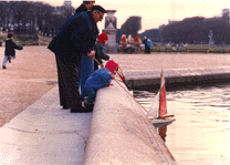 A Grandfather in the Luxembourg Garden with his Grandchild.